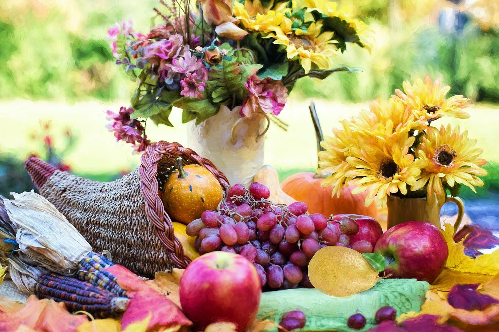 yellow sunflower and red apple fruits on green table